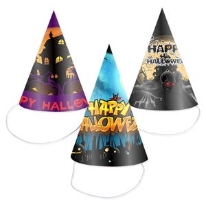 Three Halloween paper party hats with castle, skull and pumpkin designs on white background