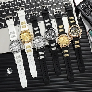 Business men's sports watches with silicone straps and large dials on a desk setup