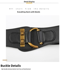 Detail of a wide black elastic waist belt featuring vintage gold D-ring hardware and faux leather