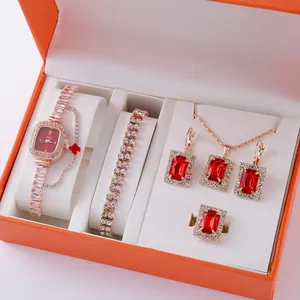 Elegant 5-piece gold women watch set with red gemstones in an orange jewelry gift box