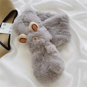 Detailed view of gray faux fur scarf with cute bear ears and embroidery on satin