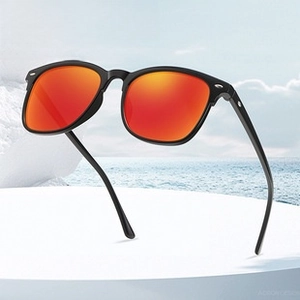 Detail of polarized sports sunglasses with red mirror lenses and black glossy frame