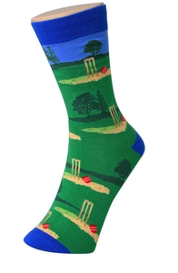 Close-up of green and blue cotton knitted socks featuring cricket patterns on a model leg