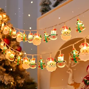 Warm white LED Christmas string lights with Santa Claus and tree shapes for festive decor