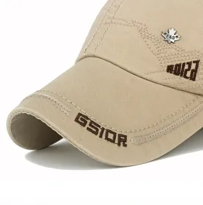 Close-up of khaki cotton baseball cap with GSIOR embroidery and silver maple leaf badge