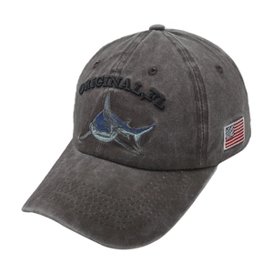 Detail of shark embroidery and American flag patch on washed gray cotton baseball cap
