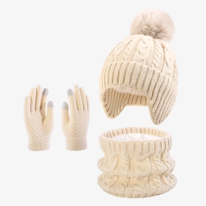 Detailed close-up of winter cable knit hat, scarf and touchscreen gloves set in cream white