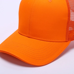 Detailed side view of orange trucker hat showing breathable mesh and curved visor stitching