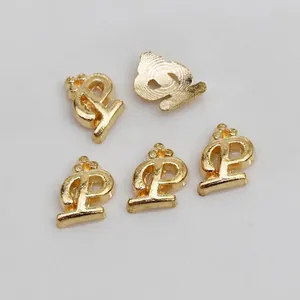 Macro shot of gold alloy 6# letter charm for DIY nail art, dimensions 7mm by 5.5mm