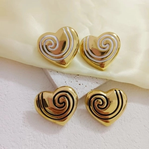Polished 18K gold plated heart earrings with black and white enamel swirl design