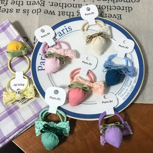 Detailed flat lay of cute plaid strawberry hair ties with lace bows in eight colors