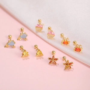Macro shot of colorful ocean life stud earrings featuring zirconia sea creatures and gold plating