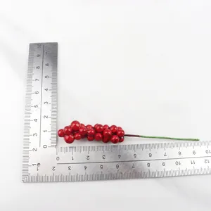 Macro view of 12cm artificial red berry stem for home decor showing product size