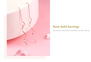 Macro shot of elegant rose gold spiral ear threads on a glass rim with pink backdrop