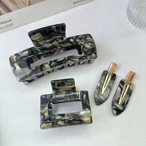 Detailed set of marble pattern acetate hair claws and clips with gold metal grips