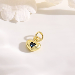 Detailed view of gold 18k plated heart pendant with blue zircon for DIY jewelry making