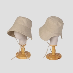 Beige wide-brim sun hat with adjustable chin strap for outdoor UV protection