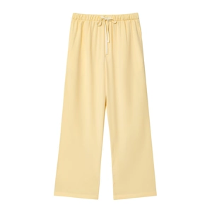 Pale yellow wide-leg lounge pants with elastic drawstring waist on white background