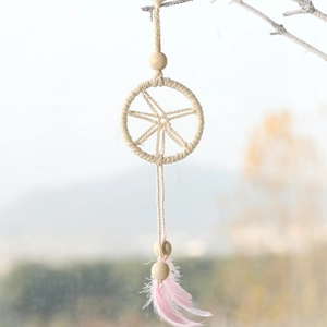 Christmas dream catcher wall hanging with beige cotton rope, wood beads and pink feathers