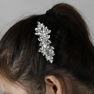 Detailed view of silver marquise rhinestone hair clip worn on elegant hairstyle