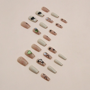 Short ballet press-on nails with stars, moons and green heart rhinestones
