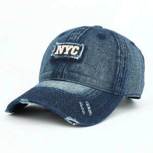 Distressed dark blue washed denim baseball cap with 3D NYC embroidery and vintage ripped details