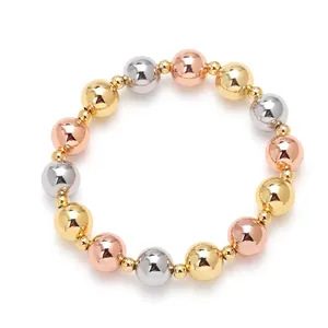 Tricolor beaded bracelet in 18k gold silver and rose gold polished finish on white backdrop