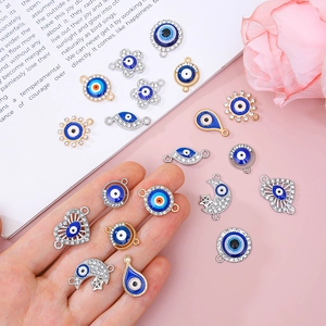 Assorted evil eye charms in gold and silver finish with blue resin and crystals