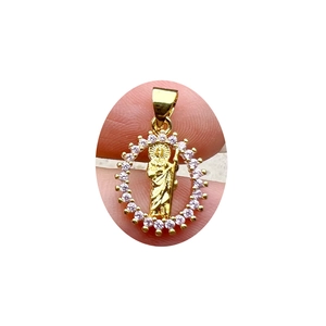 Religious Jesus round pendant in gold finish with sparkling zircon stones and relief carving