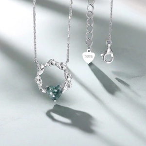 Macro view of S925 silver heart moss agate necklace pendant with leaf pattern