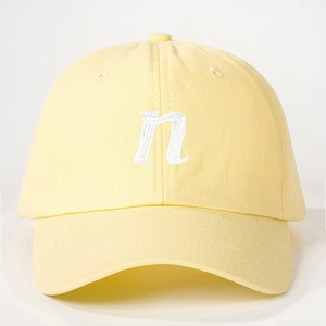 Vintage light yellow cotton baseball cap with embroidered letter n and adjustable strap