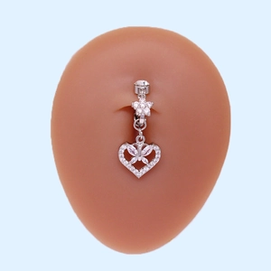 Silver belly button ring with floral stud and hollow heart pendant featuring a butterfly