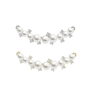 Macro shot of curved jewelry pendants with white pearls and sparkling crystal flowers