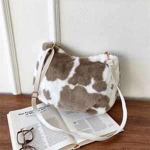 Furry cow print tote bag with adjustable strap and plush texture for women