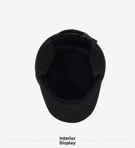 Detail view of winter flat cap interior with warm lining and fold-down ear flaps