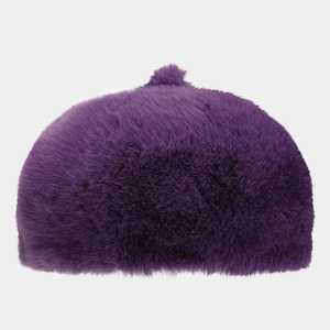 Close-up detail of soft purple plush beret showing dense faux fur texture and warm fabric
