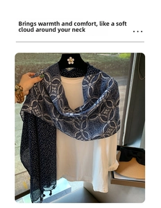 Detailed view of dark blue cotton linen scarf with white polka dots and fringe trim