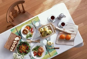 Scenic PVC placemat featuring oil painting style set on a cozy breakfast table scene