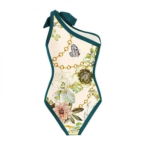 One-shoulder floral printed swimsuit with bow detail and retro gold chain pattern