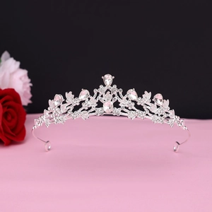 Detailed view of luxury baroque silver crown featuring sparkling teardrop crystals