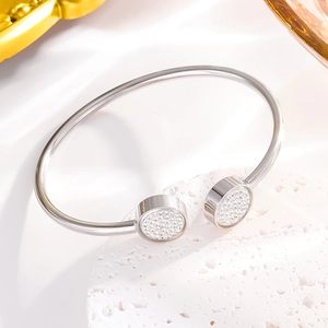 Minimalist silver open bangle with circular ends pavé-set with shimmering white crystals