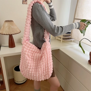 Pink bubble texture tote bag with large capacity shown in a warm indoor home lifestyle setting