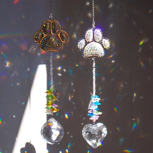 Rainbow pet memorial suncatchers with crystal paw prints and colorful heart prisms