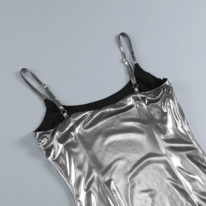 Detail of silver metallic coated camisole showing shoulder straps and stitching quality
