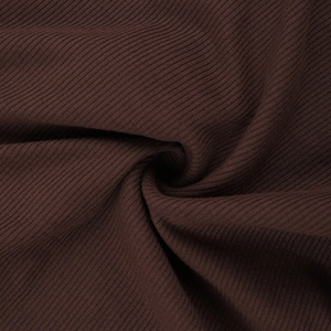 Macro shot of dark brown ribbed knit fabric texture with soft vertical stripes and drape
