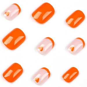 French orange heart press-on nails set with glossy finish and clear almond design
