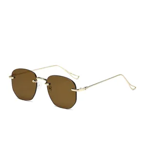 Frameless brown gradient sunglasses with gold metal temples and teardrop cutout tips