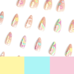 Press on nails with almond shape, rainbow stars, and colorful flowers on nude base