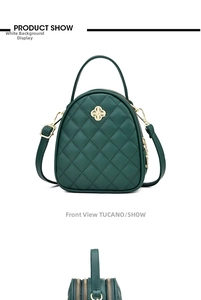 Détails de sac à main en cuir matelassé vert foncé avec fermoir trèfle doré