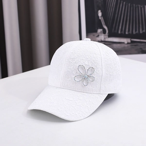 Women's white lace baseball cap featuring elegant rhinestone floral design and curved brim